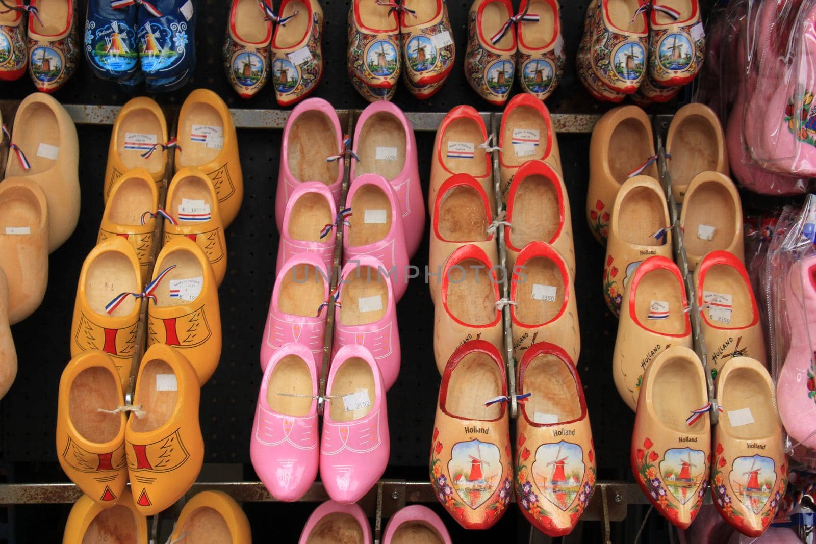 Colorful painted clogs, the traditional Dutch wooden shoes in a tourist shop