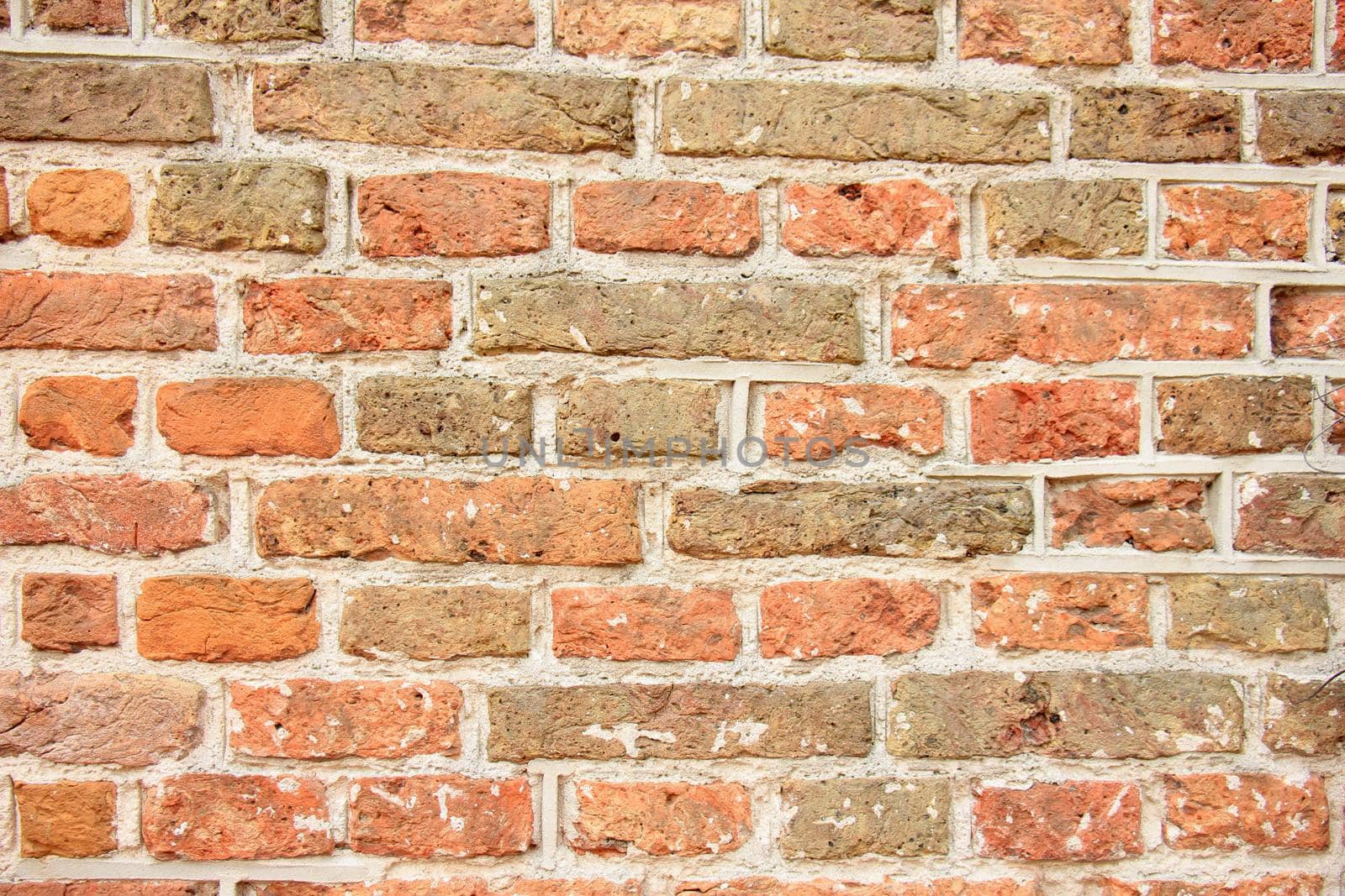 Vintage red bricks in an old brick wall by studioportosabbia