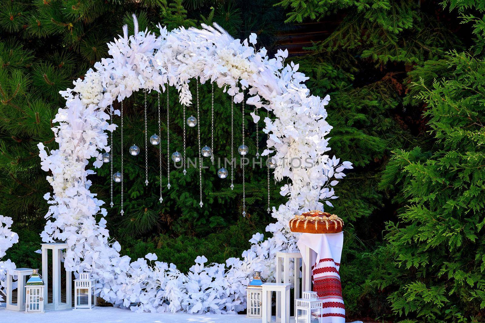 Snowy white wedding festive arch for a meeting of the newlyweds by jovani68