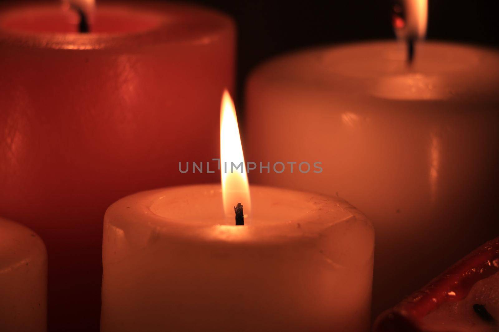 Group of burning candles by studioportosabbia