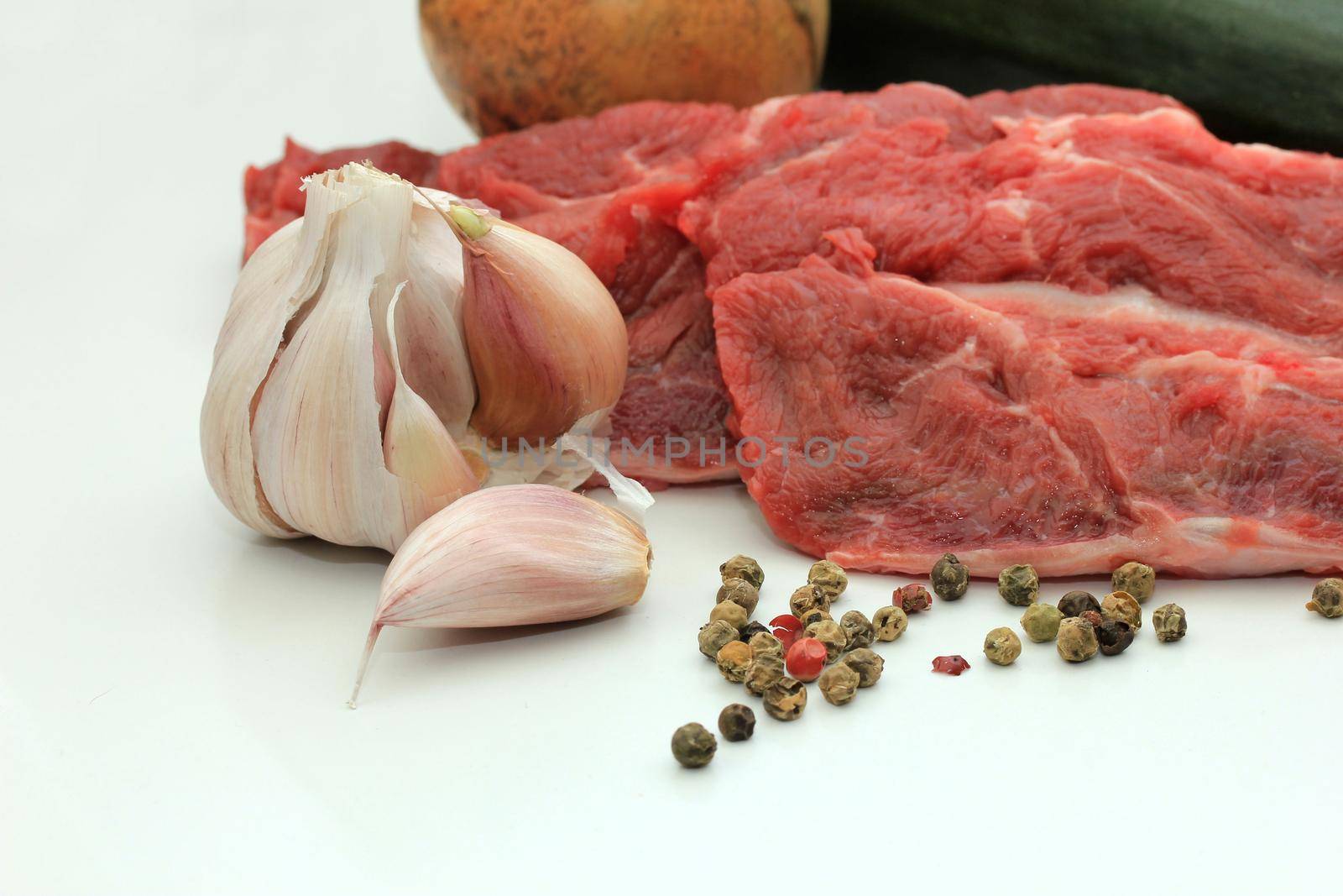 Raw beef, some garlic and mixed pepper