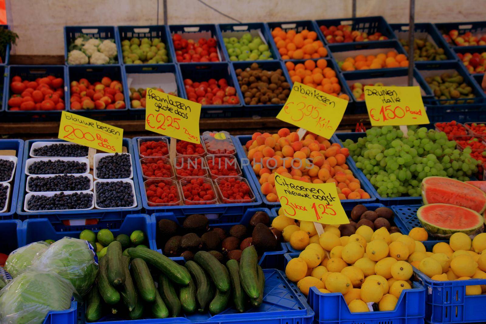 Fresh fruit on a market stall by studioportosabbia