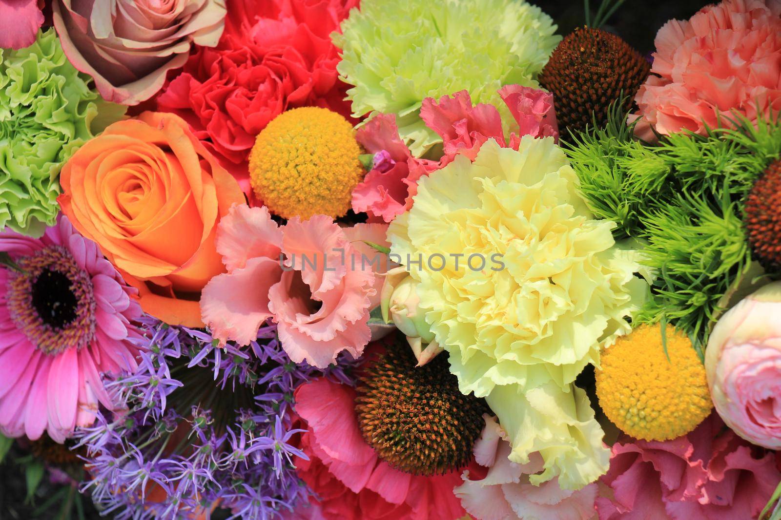 Mixed flower arrangement: various flowers in different pastel colors for a wedding