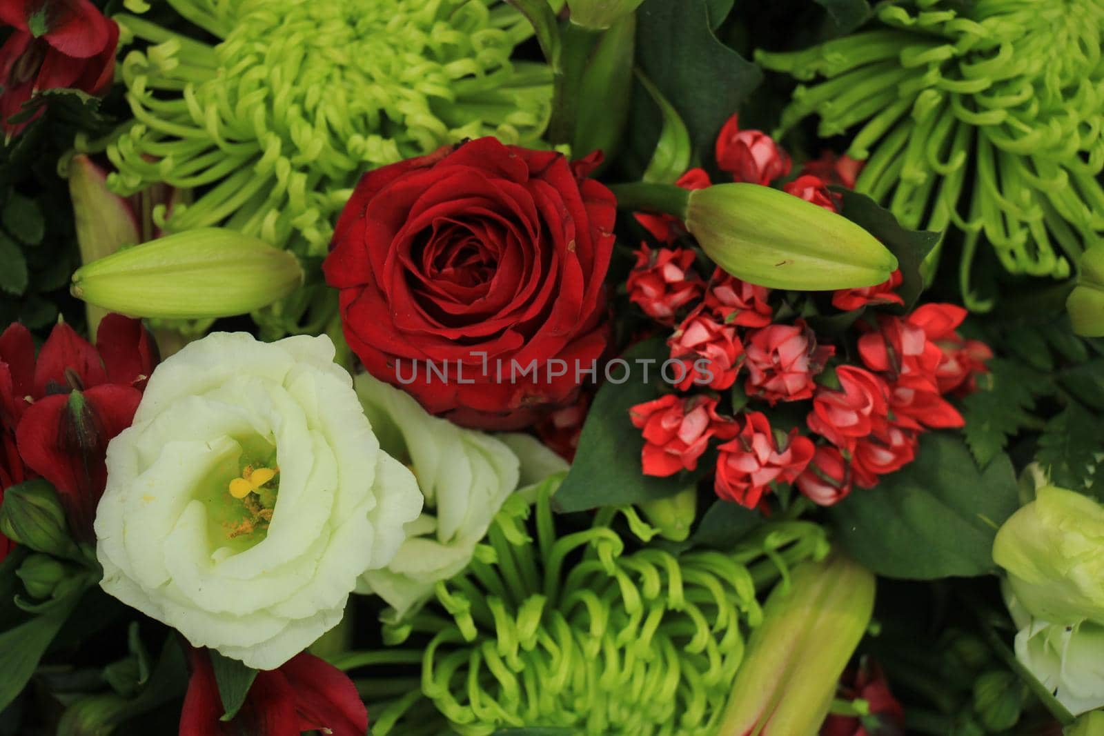 Classic green,  red and white bouquet for a wedding