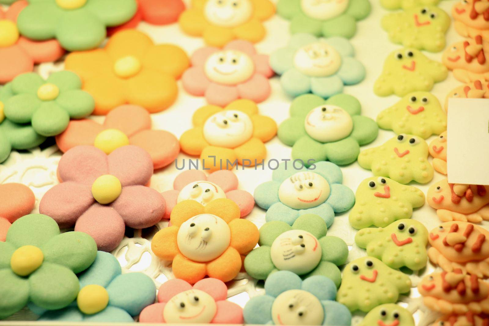 Pastel sugar candy on display in a pastry bakers shop