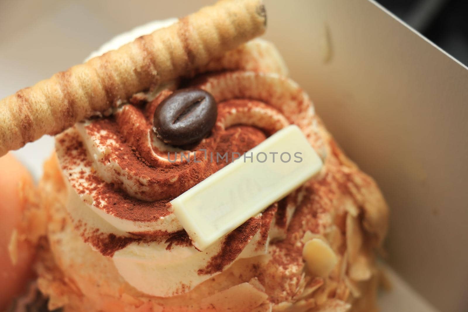 Fresh made mocha cake or confectionery in a carton box