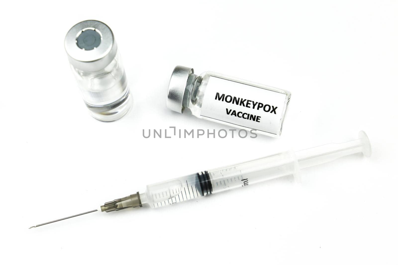 Vials and syringe filled with Monkeypox vaccine by soniabonet