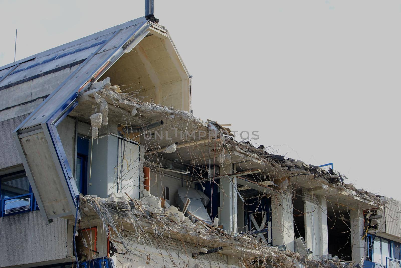 Demolishing a building, half demolished industrial building