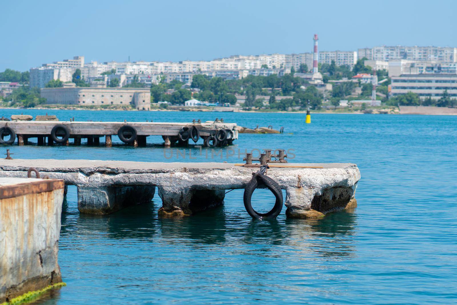 RUSSIA, CRIMEA - JUL 08, 2022: Rope bollard water sea pier travel marina dock port wharf, for vessel summer from scenic and yachting anchor, line pace. Dolomites beauty oman, by 89167702191