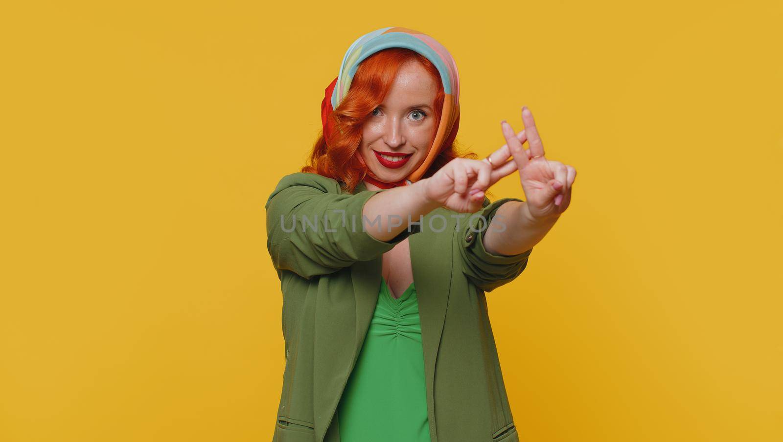 Hashtag. Cheerful redhead young woman showing hashtag symbol with hands, likes tagged message, popular viral content, sign to follow internet online trends. Ginger girl isolated on yellow background