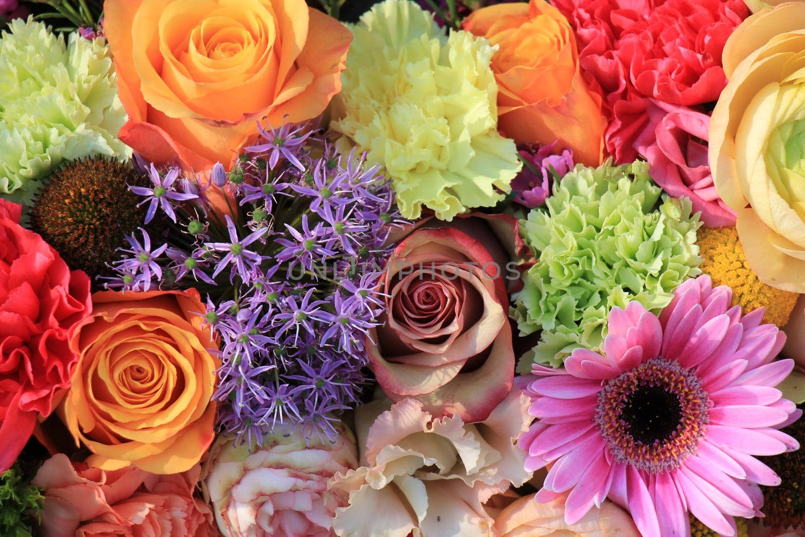 Mixed flower arrangement: various flowers in different pastel colors for a wedding