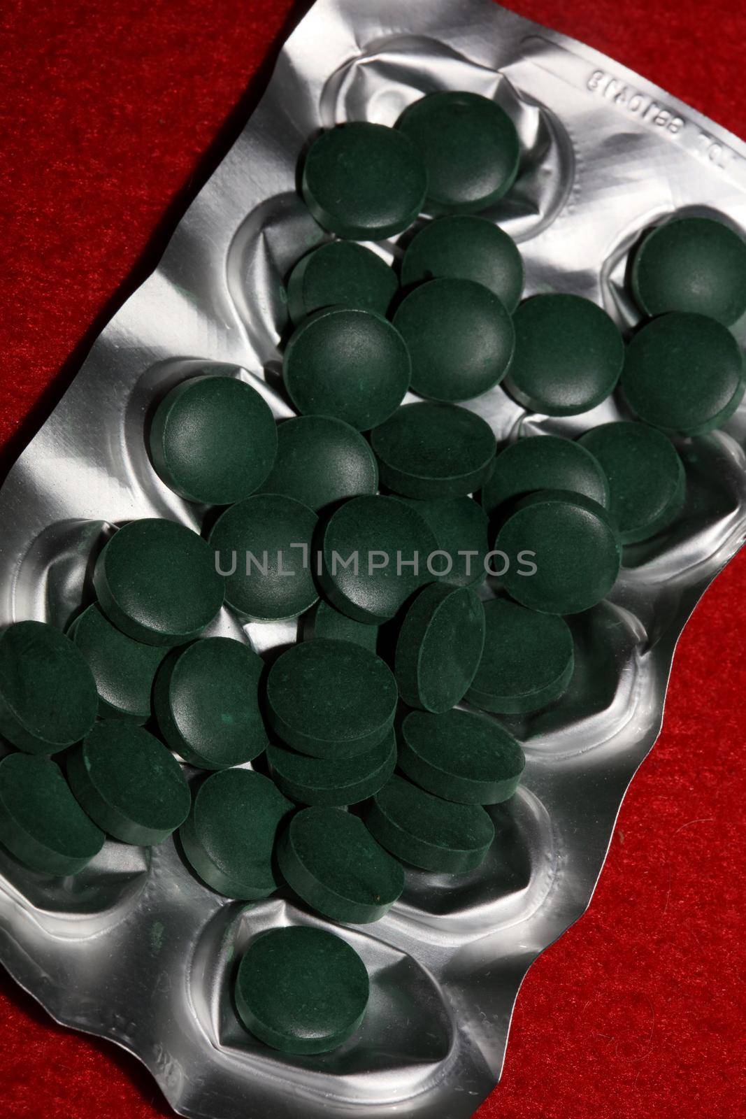 Medical green round vitamins spirulina platensis healthy super food close up background high quality big size prints