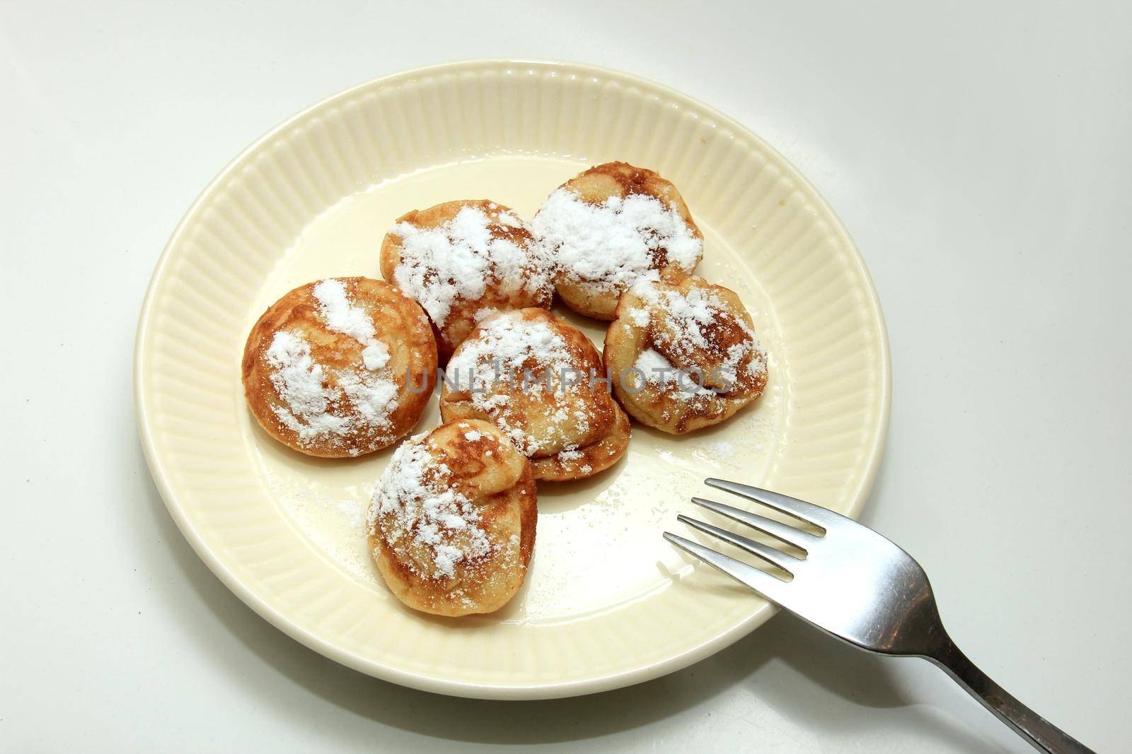 Cereal pancakes Poffertjes, Dutch small, fluffy pancakes by studioportosabbia