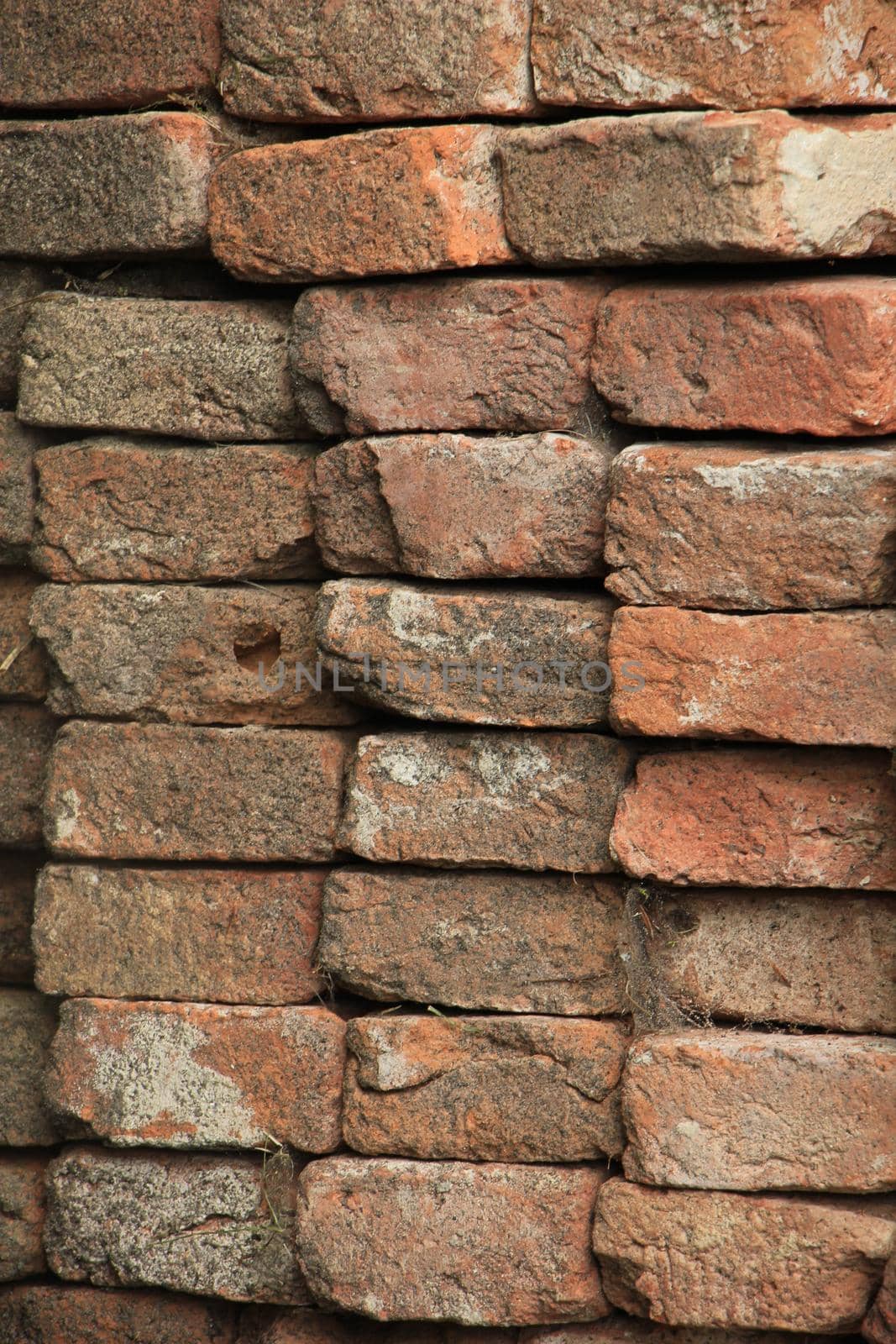 Pile of broken red bricks on construction site