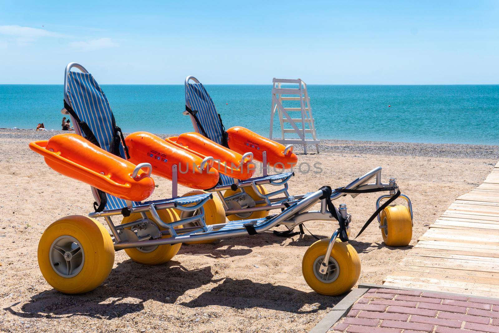 Swimming stroller bathing handicapped wheelchair people disabled disabilities sea spring, concept walk ocean in nature and talking beach, daughter girl. Home love outdoor,