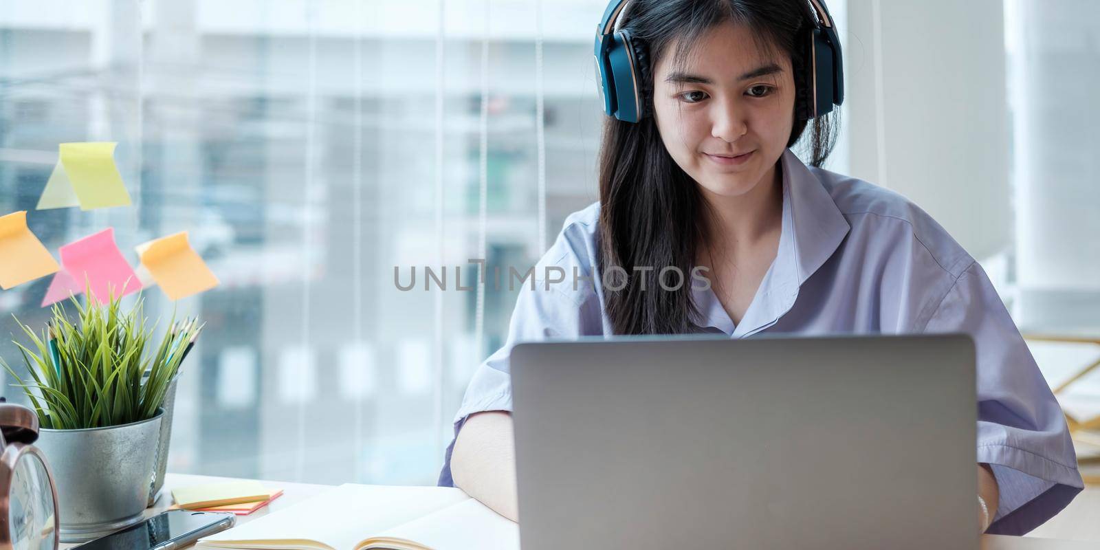 Homeschool Caucasian cute young girl student learning virtual internet online class from school teacher by remote meeting due to covid pandemic. Male teacher teaching math calculus by using whiteboard by wichayada