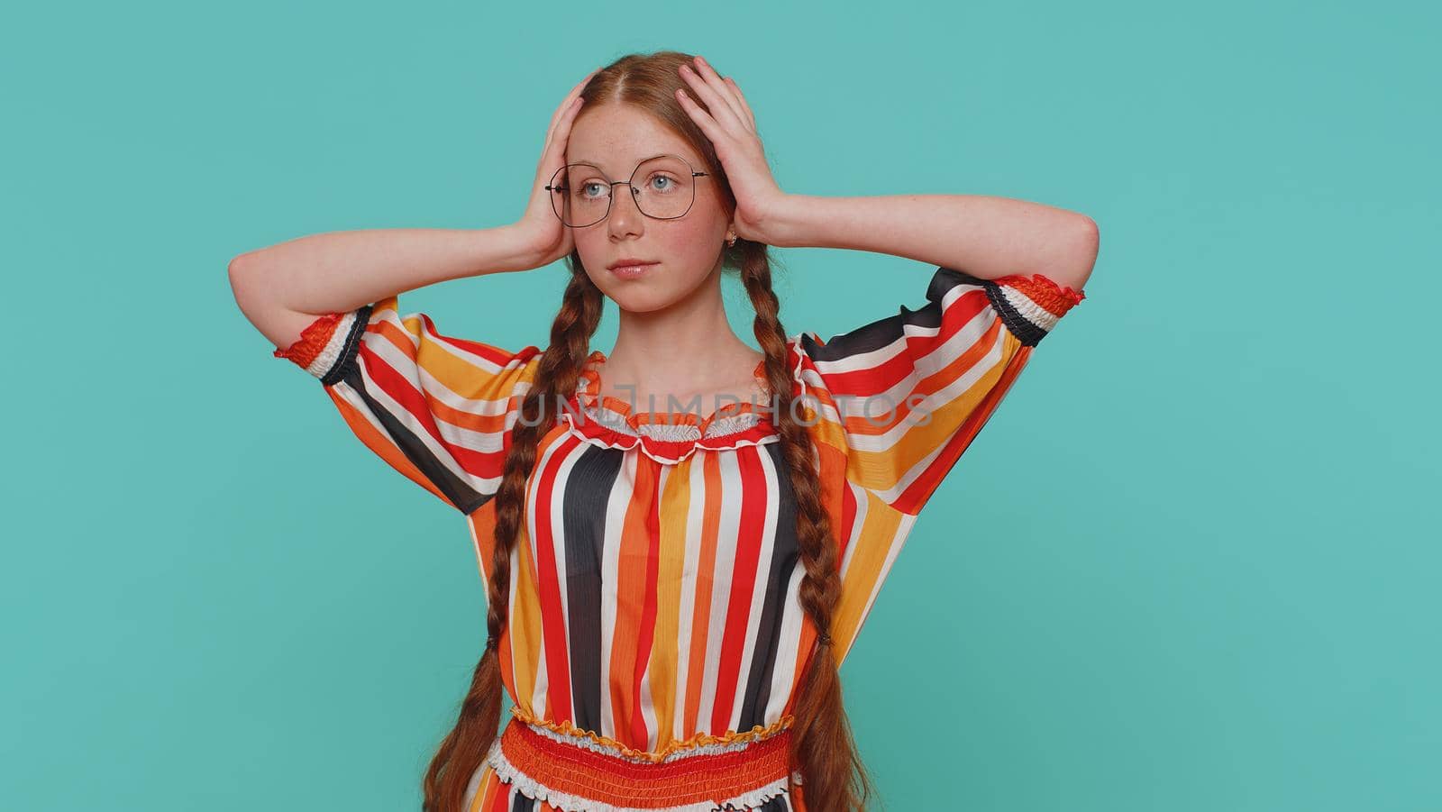 Sincere redhead ginger girl in dress wishing, waiting for good luck and loses becoming surprised sudden lottery results, bad news, fortune loss fail. Young teenager child isolated on blue background