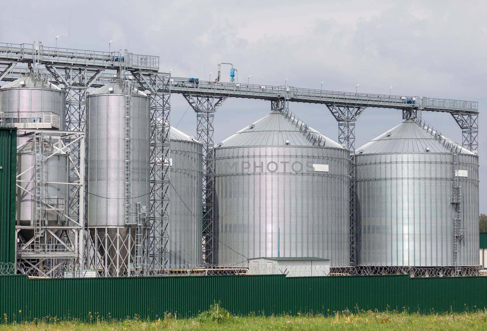 Modern large granary agro silos elevator on agro-processing by AnatoliiFoto