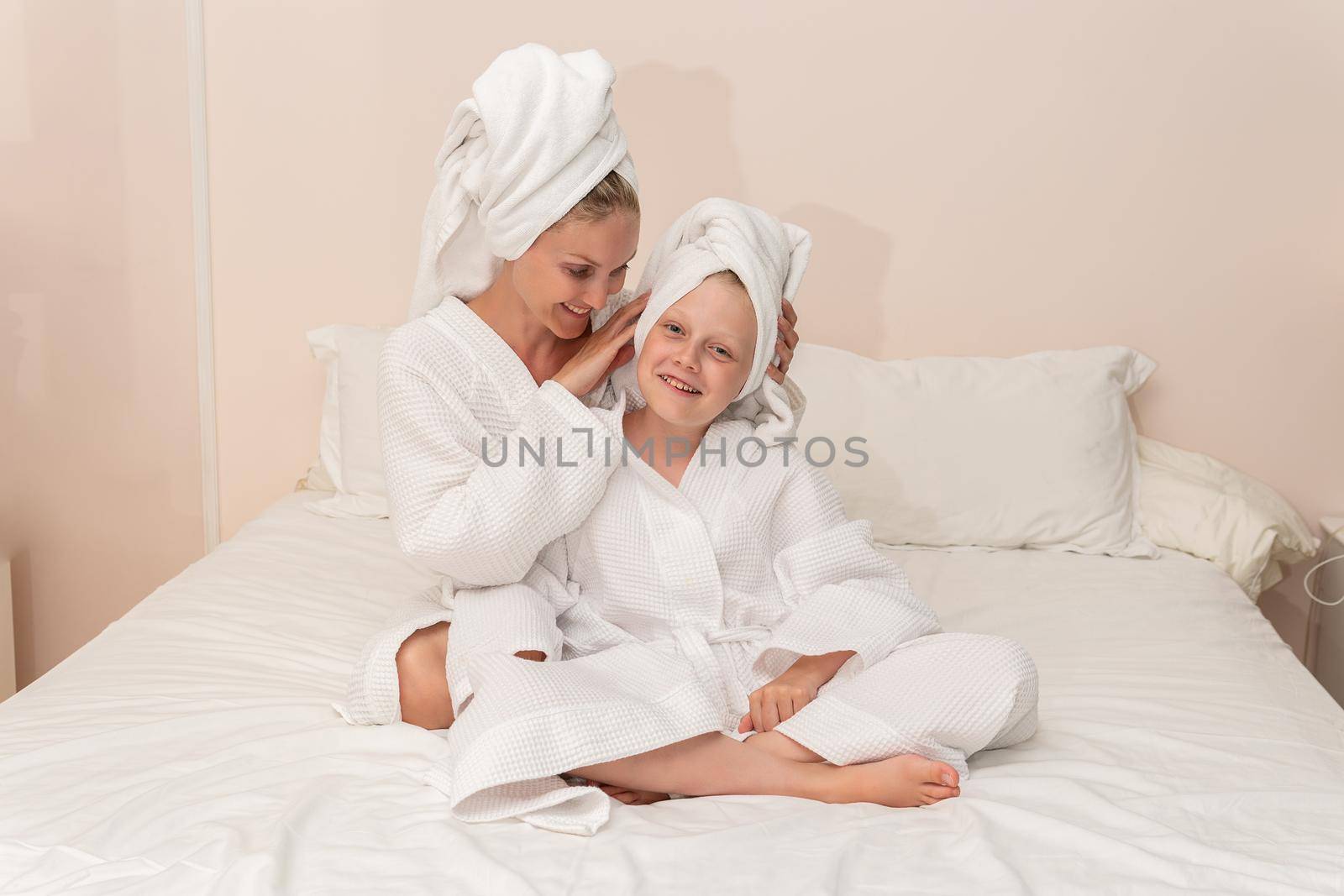 Daughter bath dries smiling mom love thinks elbows smile bed, from girl morning in lifestyle for happy caucasian, little background. Hair health female, by 89167702191