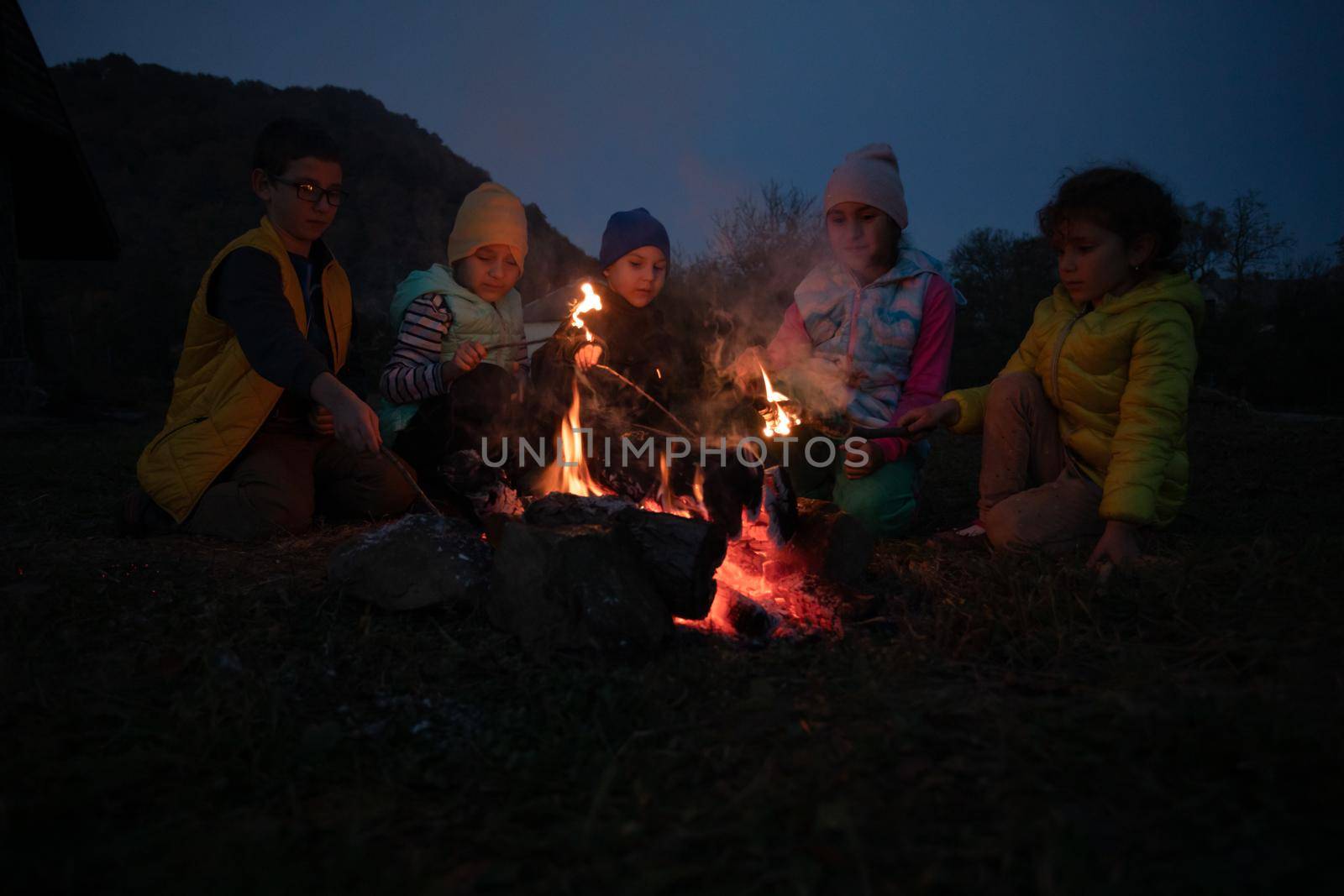 Children in the camp by the fire. by oksix