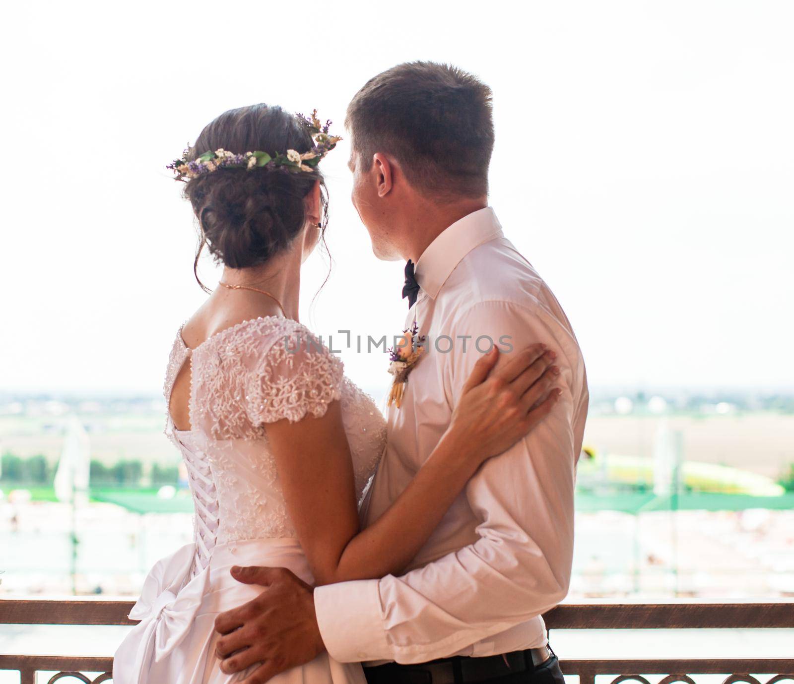 Happy bride and groom after wedding ceremony walking at the park and have photoshoot