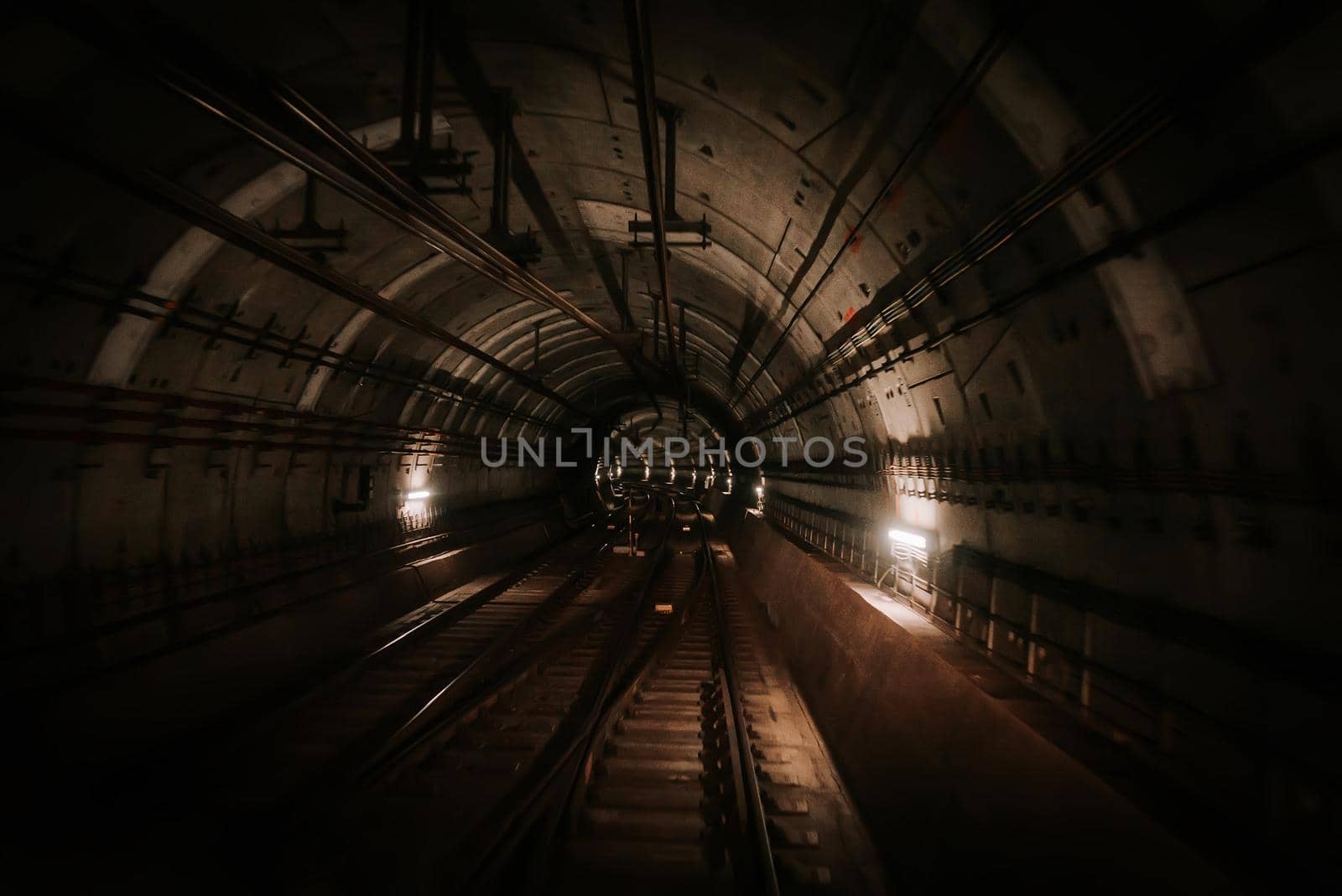 Moving driverless metro train in Oslo, Norway. Riding forward through underground tunnel. Advanced subway transportation system. High quality photo