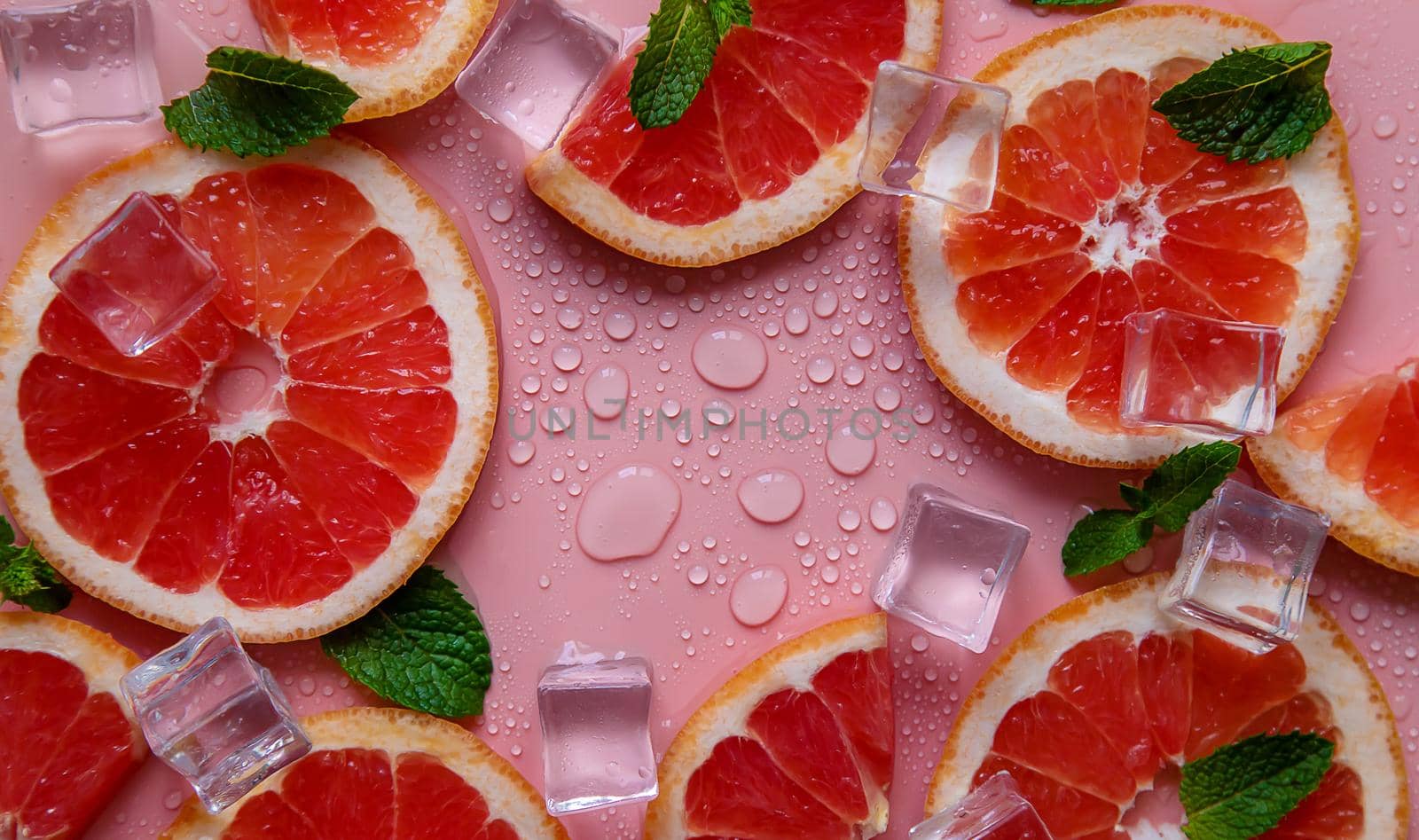 Background with grapefruit and water drops. Selective focus. Spa.