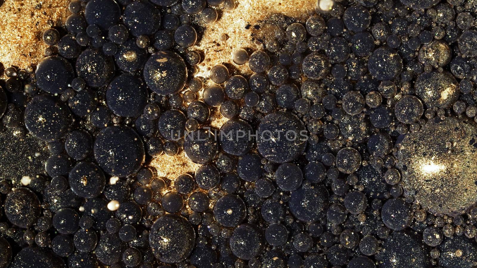 Top view abstract of black gold bubbles in paint. Inks, spheres, oil. Shapes. Detailed background, beautiful design, balloons texture. High quality photo