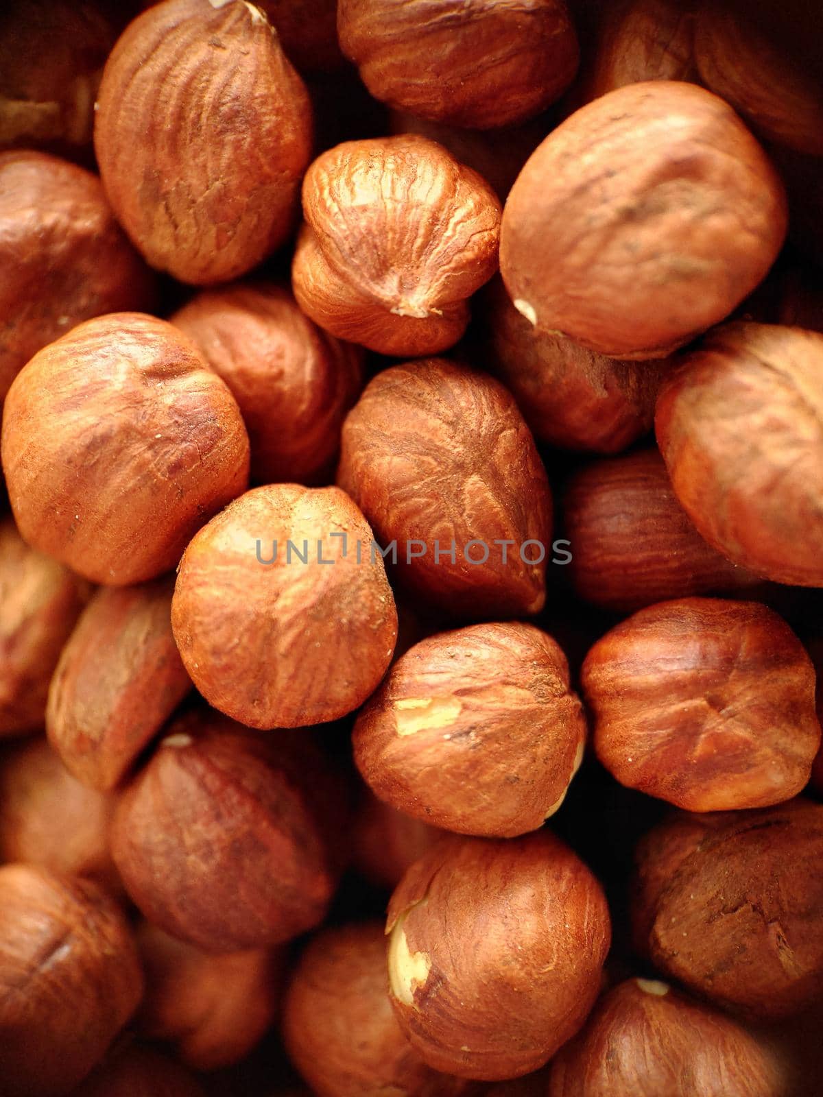 Macrophotography.A handful of peeled large hazelnuts .Texture or background