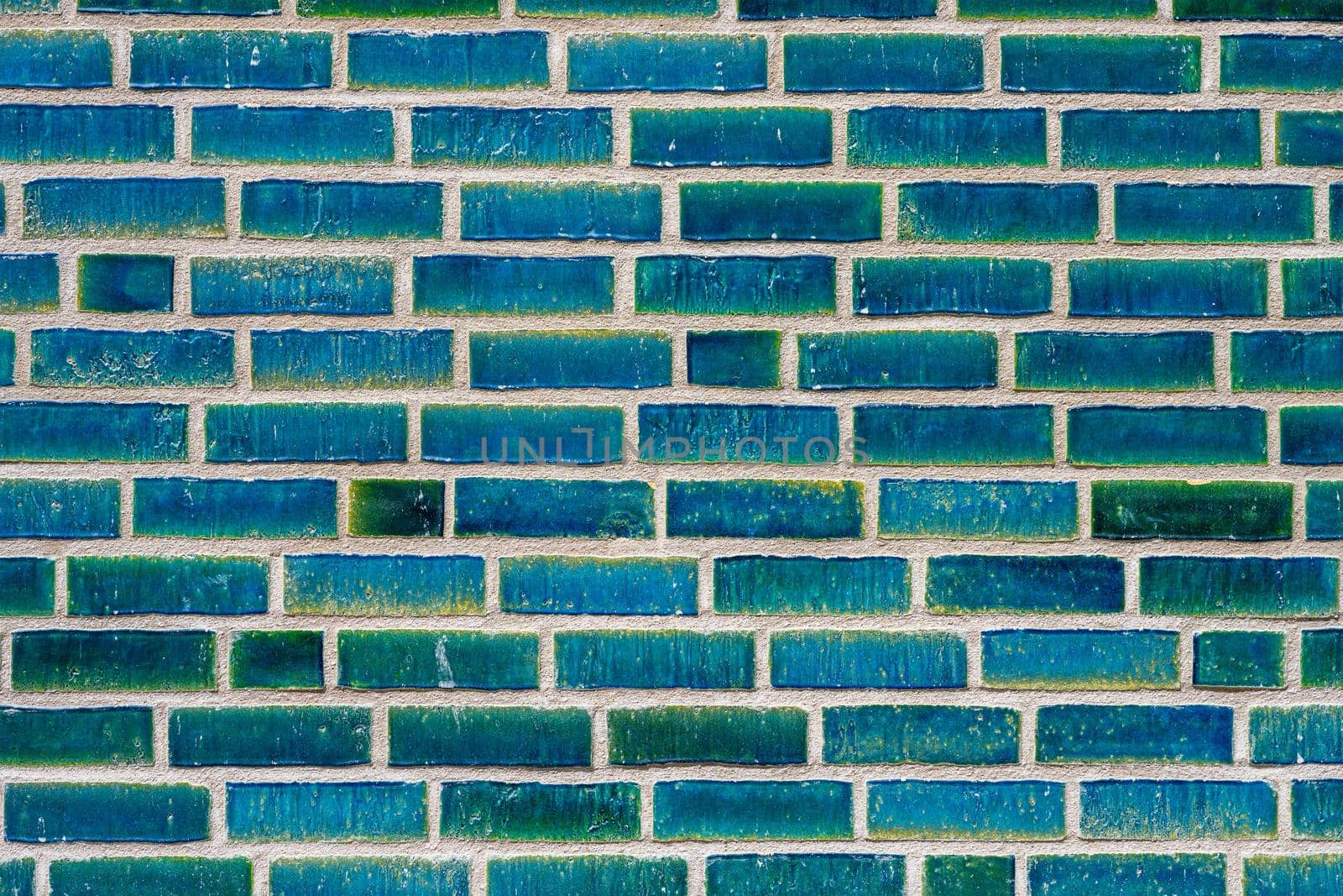 Background from a wall made of turquoise bricks