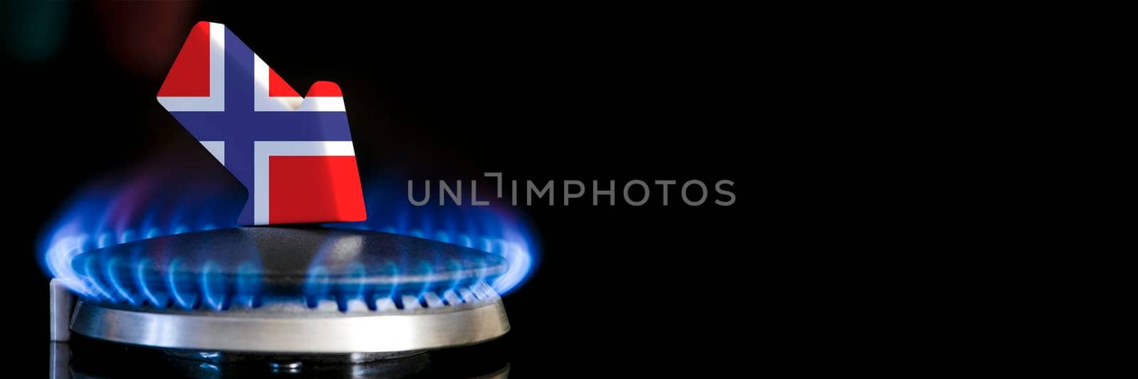 Decreased gas supplies in Norway. A gas stove with a burning flame and an arrow in the colors of the Norway flag pointing down. Concept of crisis in winter and lack of natural gas. Heating season. by SERSOL