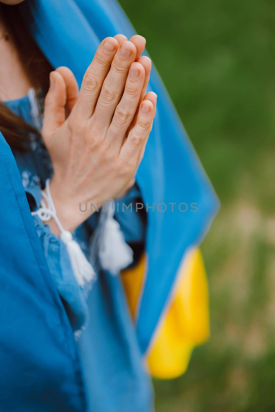 Pray for Ukraine, stand with. Ukrainian woman with national flag. Young lady in blue embroidery vyshyvanka. Independence, freedom, patriot symbol, victory in war, namaste, peace concept. quality photo