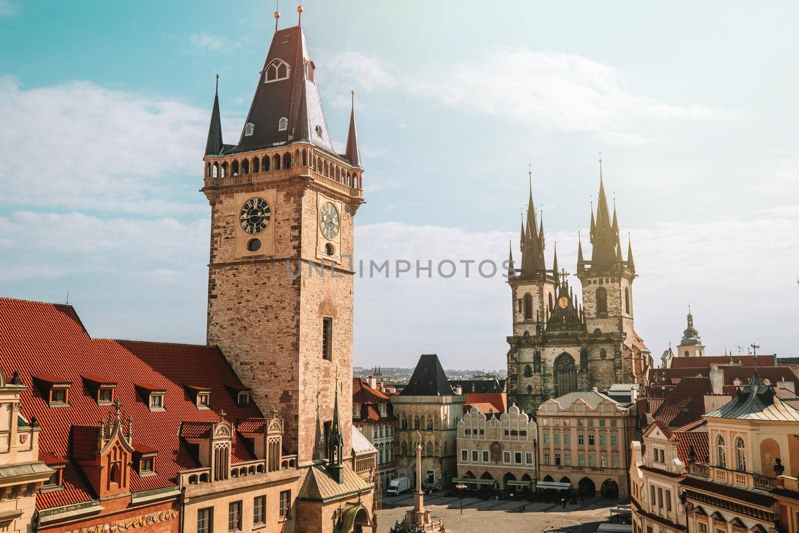 Old Prague town square with Church of our Lady before Tyn, astronomical chimes. Famous historical, gothic style buildings. Sunny cityscape in european capital. High quality photo