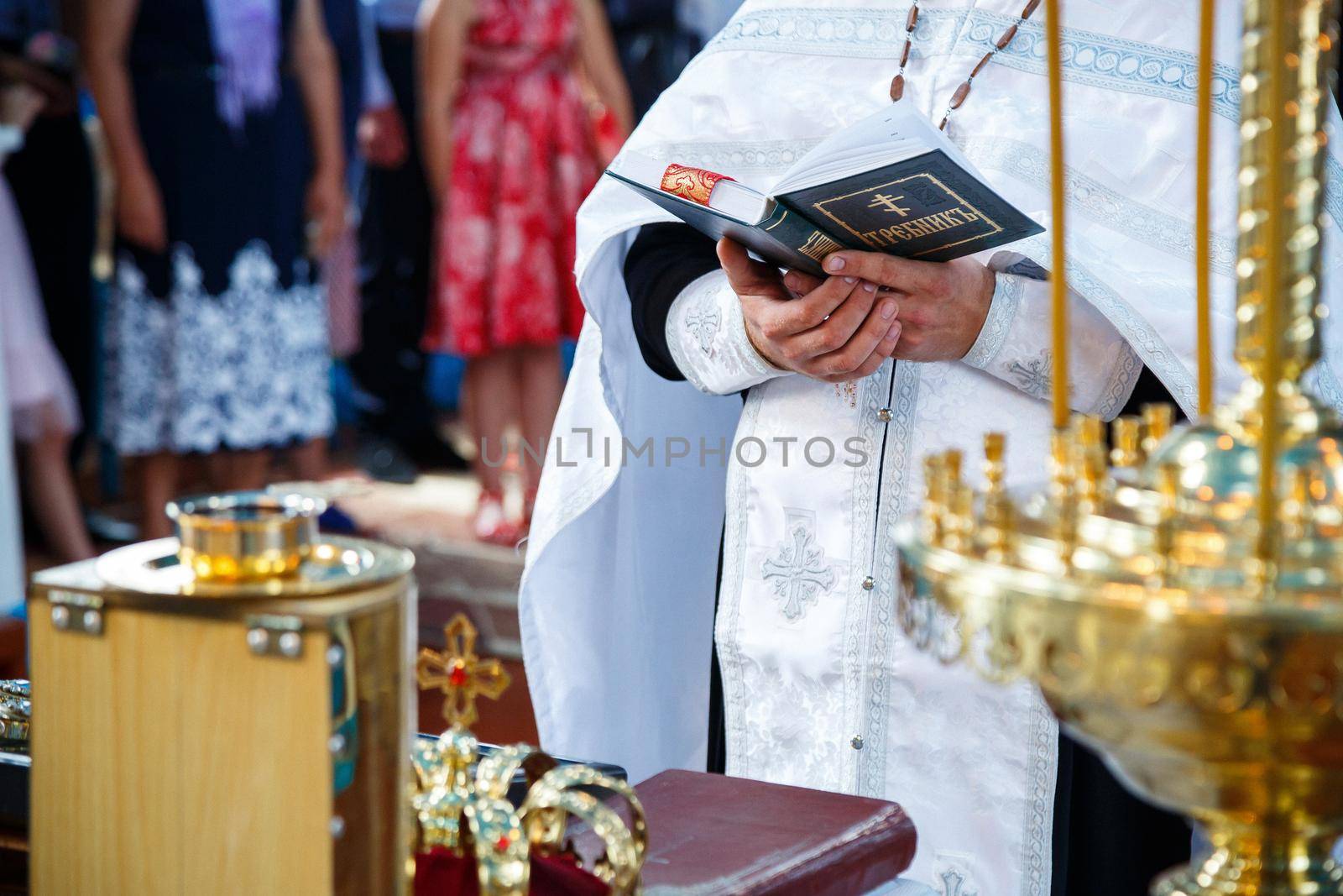 Orthodox religion. Hands of the priest on the bible.
