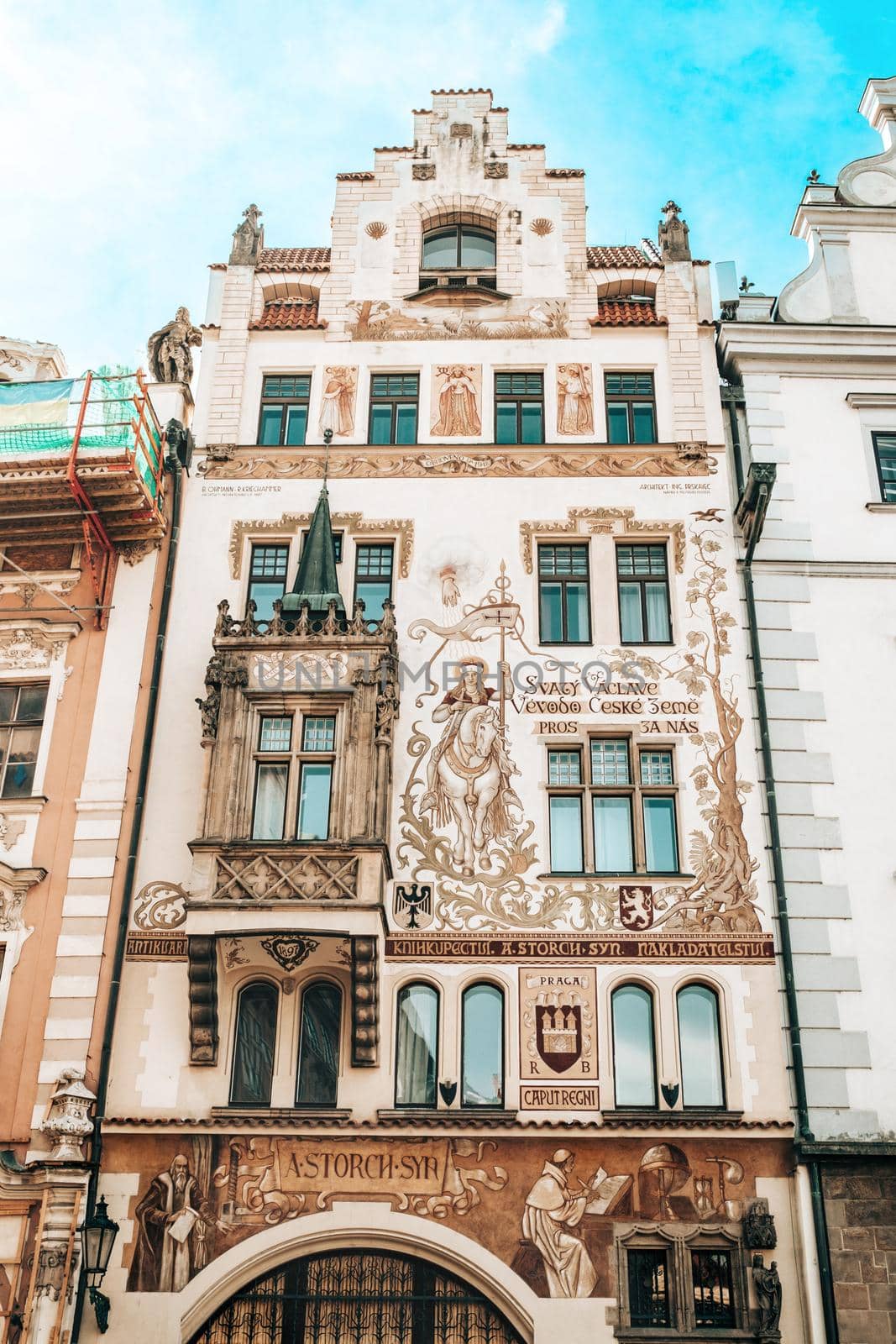 Prague, Czech Republic - July 2022. Facade of Storch House (Storchuv dum) publishing in Neo-Renaissance style. Balcony and decorated frescoes building in european capital,Old town square. High quality