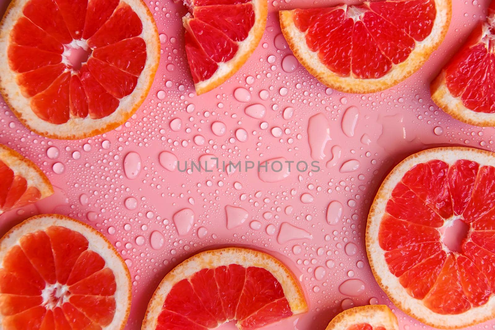 Background with grapefruit and water drops. Selective focus. Spa.