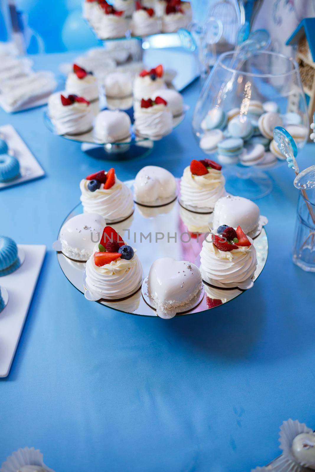 Sweet cupcakes and cakes for a children's party. Confectionery. Selective focus by Dmitrytph