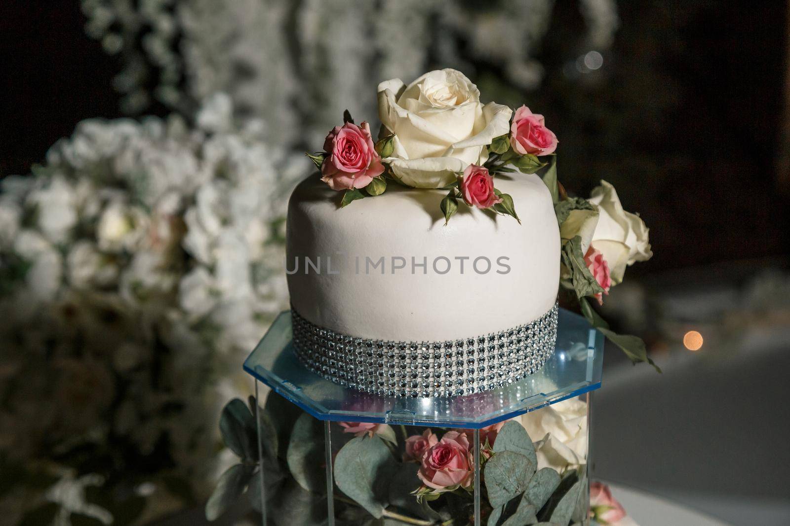 Beautiful tiered delicious dessert sweet cake for newlyweds. Selective focus