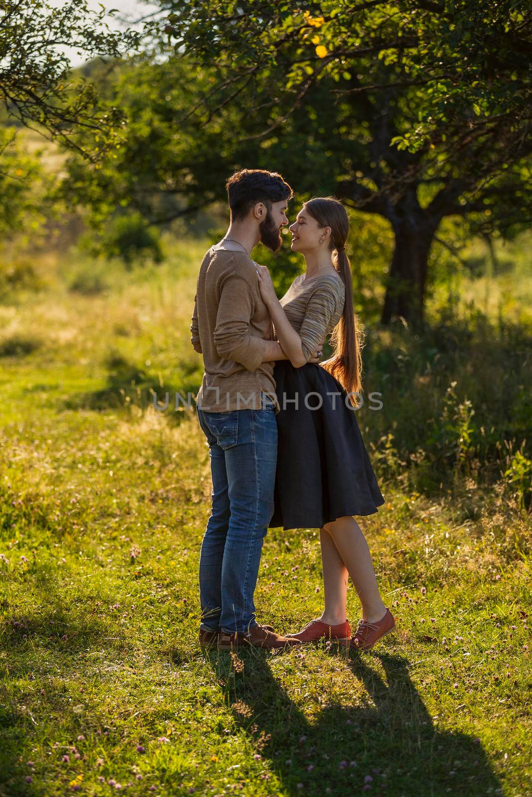 young couple hugging in nature by zokov
