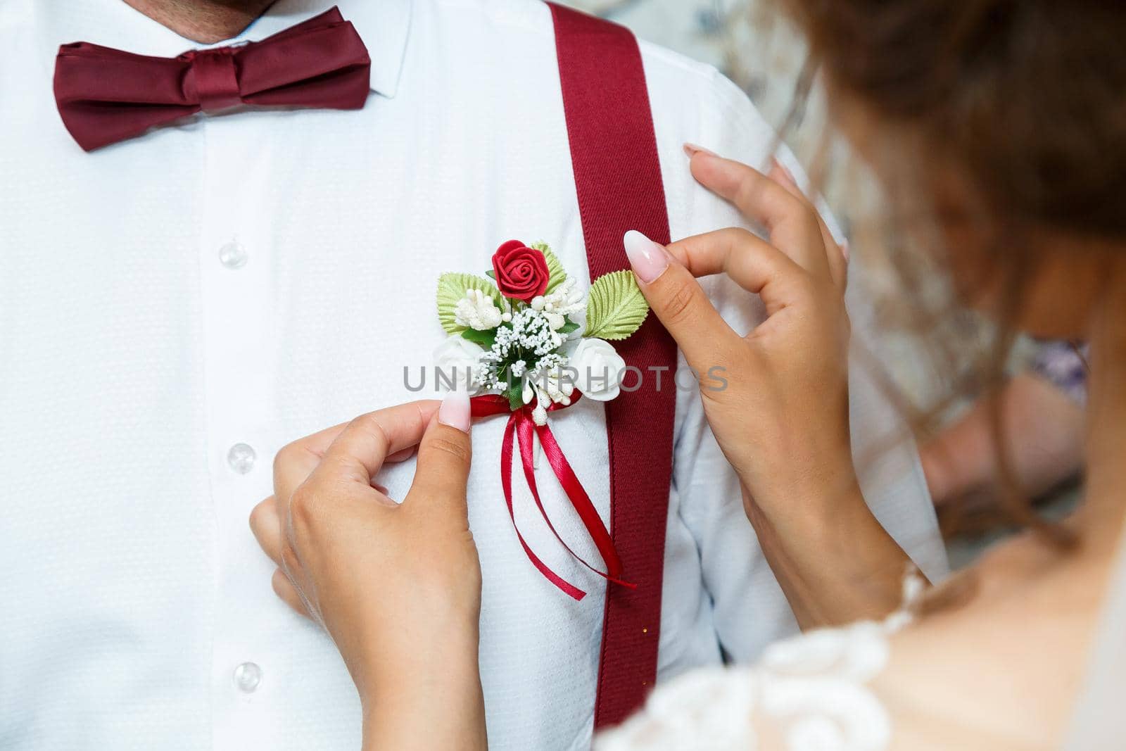 Beautiful wedding bouquet of flowers in the hands of the newlyweds by Dmitrytph