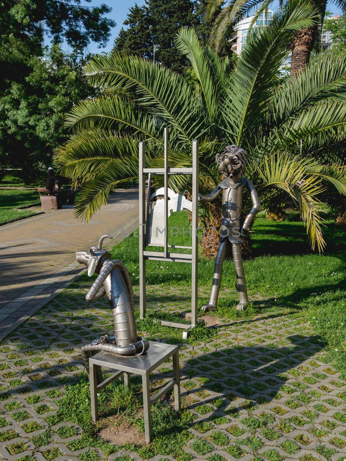 SOCHI, RUSSIA - May 27, 2021. Metal statues of animal artist and model by Hakob Khalafyan near Art Museum. by aksenovko