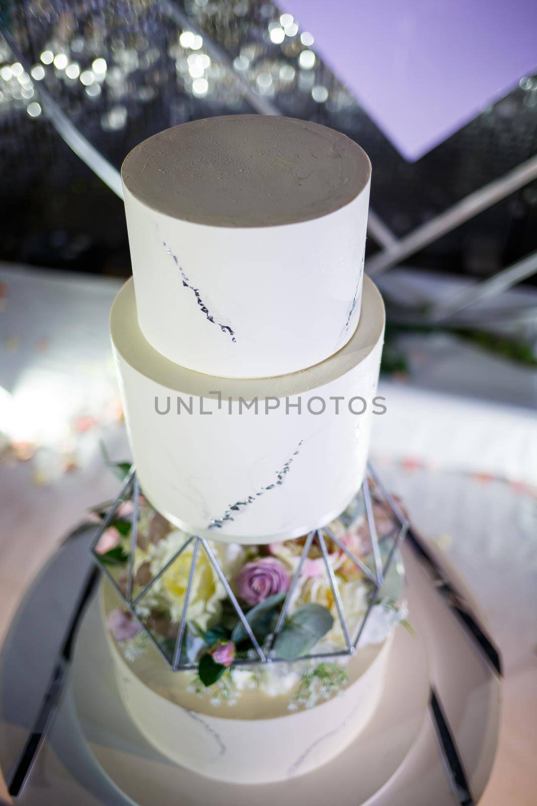 Beautiful tiered delicious dessert sweet cake for newlyweds. by Dmitrytph