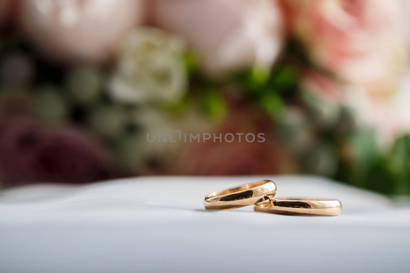 Gold wedding rings for newlyweds on wedding day