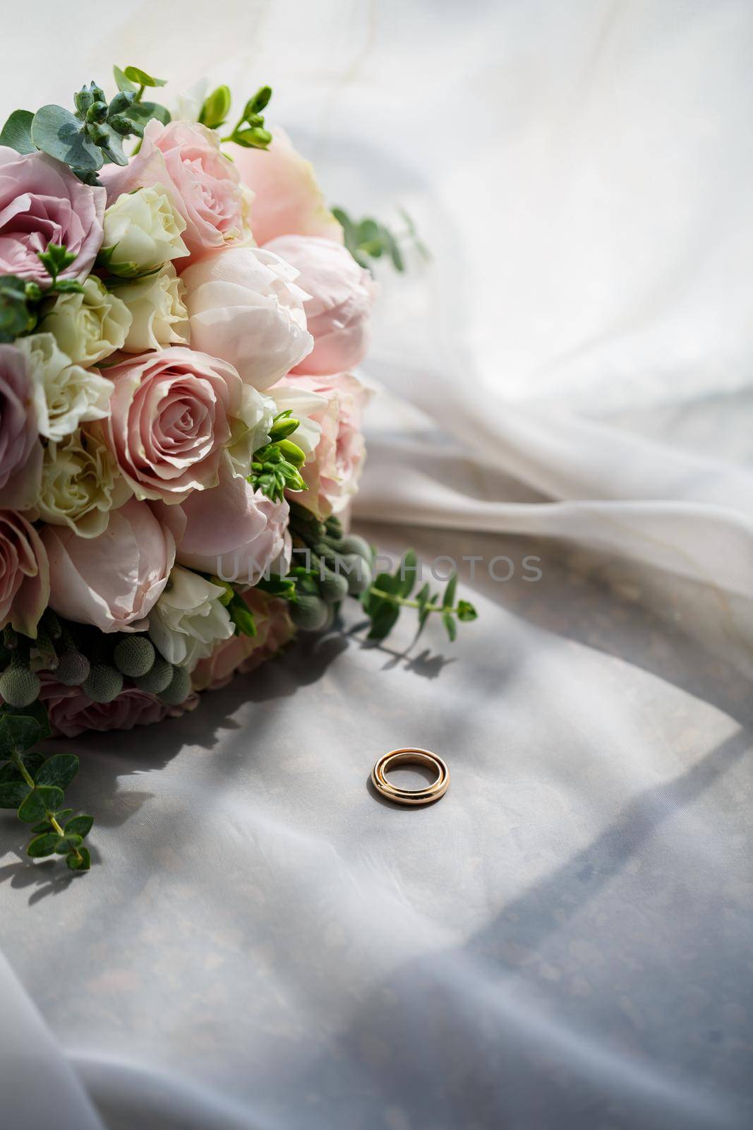 Gold wedding rings for newlyweds on wedding day by Dmitrytph