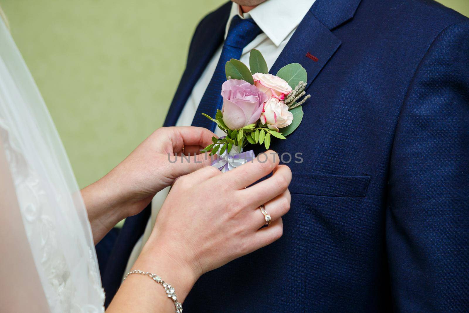 Bride cuddle with groom on wedding day