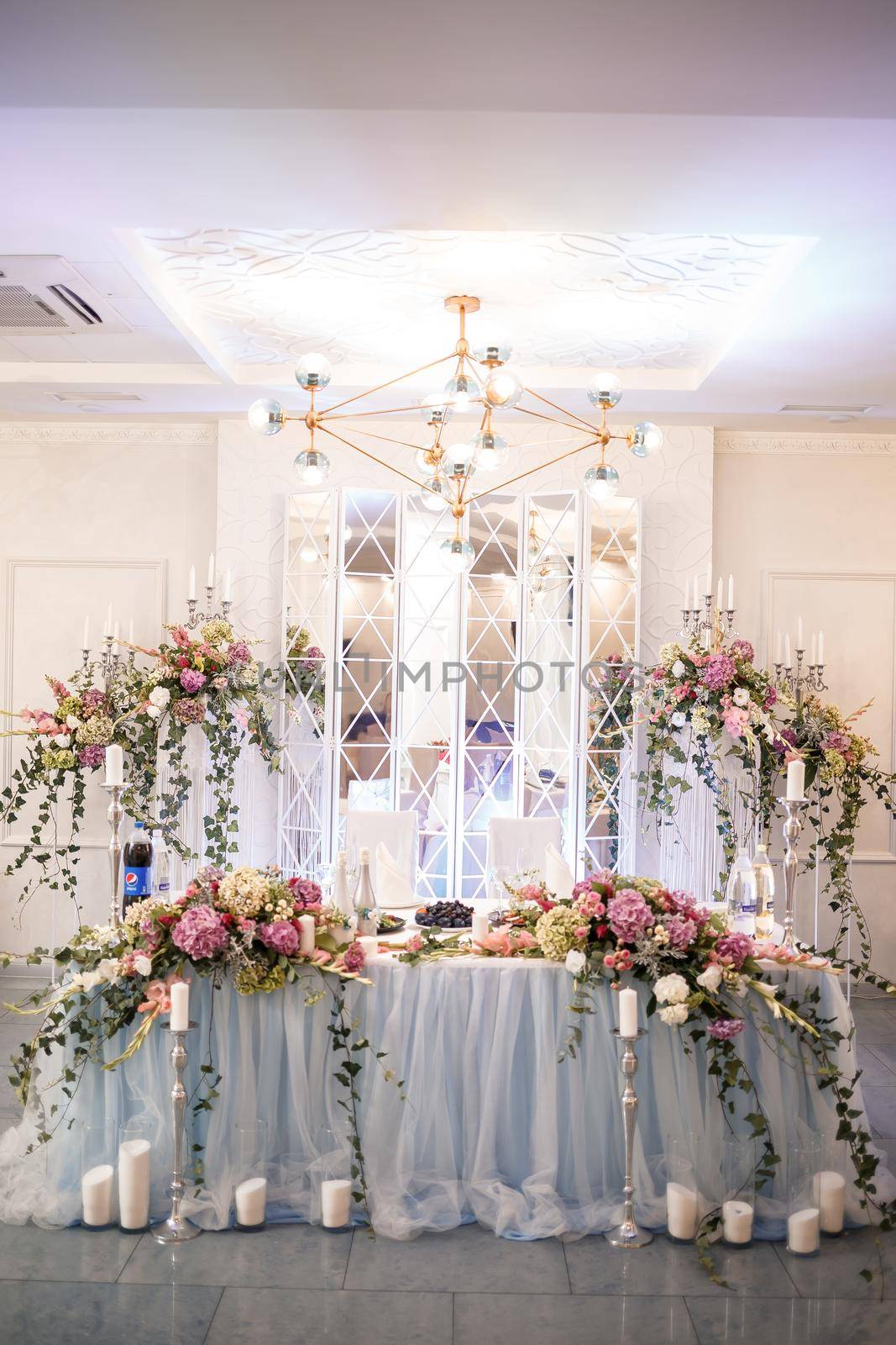 Wedding decor made of flowers and fabric. Beautiful decorations for newlyweds on their wedding day by Dmitrytph