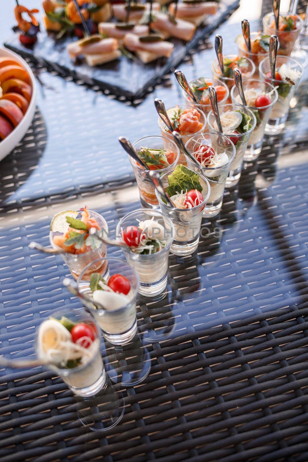 Buffet table for guests at a banquet with various snacks and sandwiches