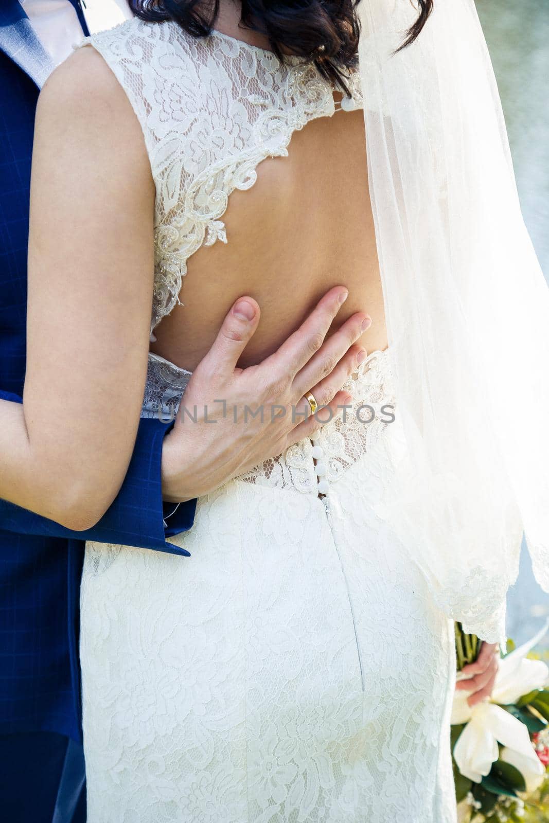 Bride and groom hugging on a wedding day