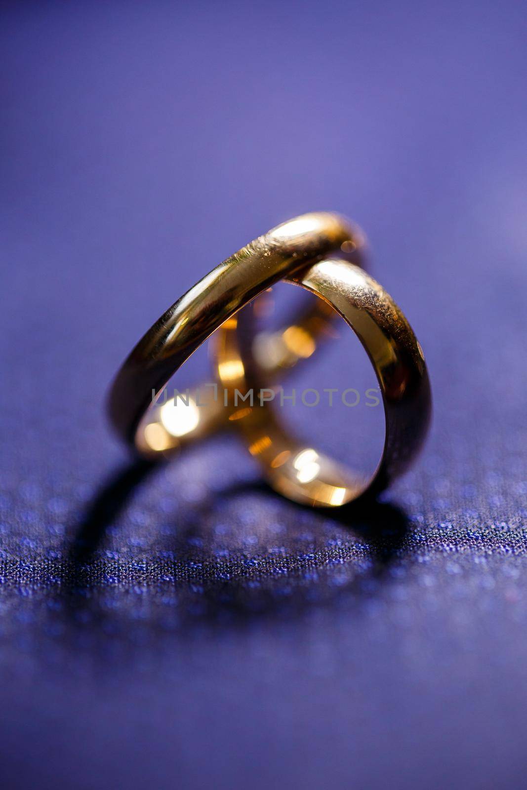 Gold wedding rings for newlyweds on wedding day