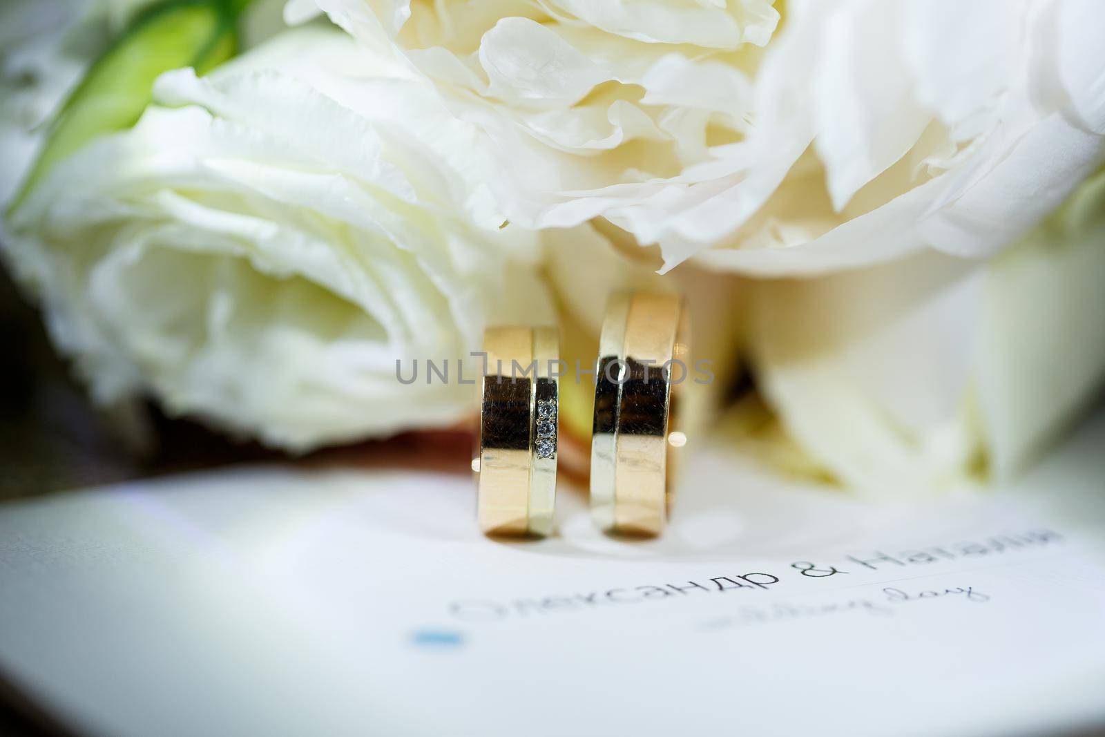 Gold wedding rings for newlyweds on wedding day